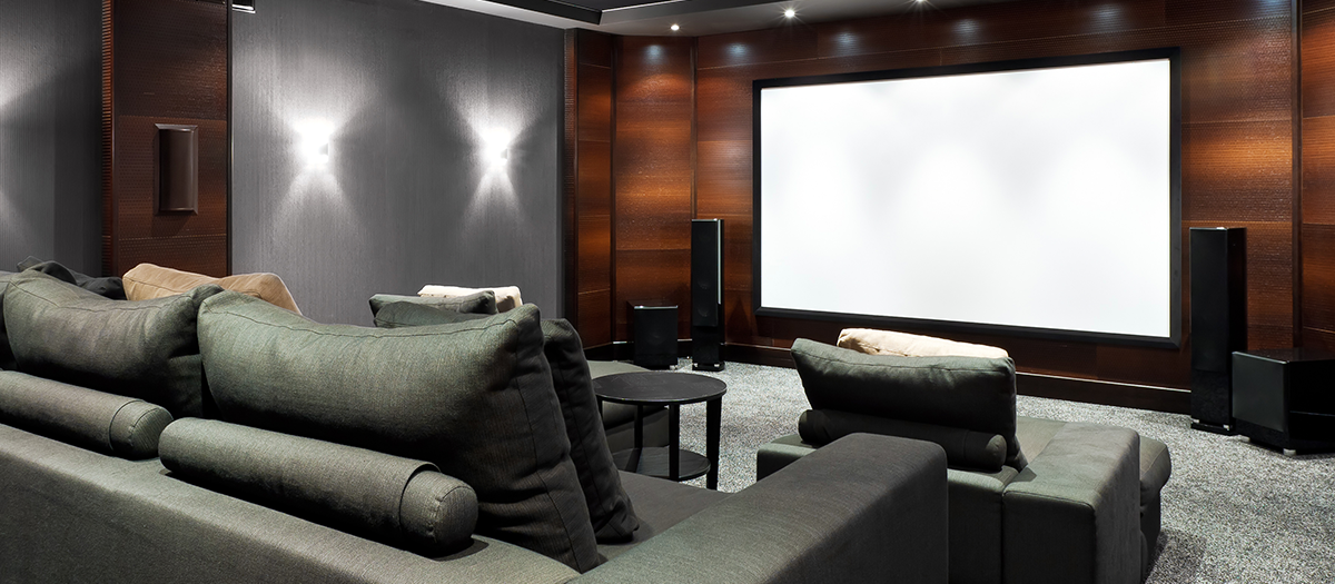 Custom Park City home theater with designer seating, acoustic wall panels, and precision audio-video integration tailored to unique architectural styles