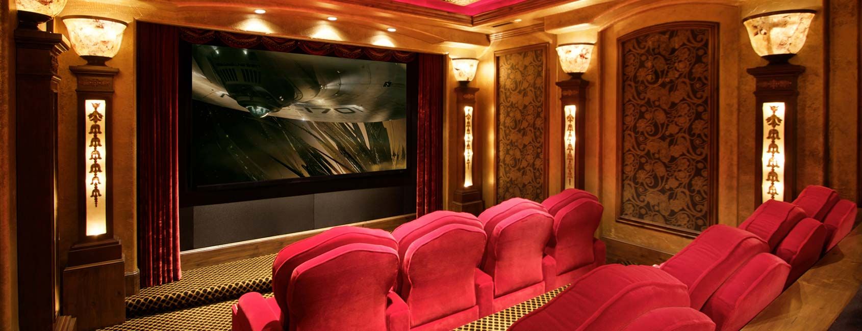 Park City home theater with custom CINEAK luxury seating, acoustic wall treatments, and high-end speaker array for optimized comfort and viewing